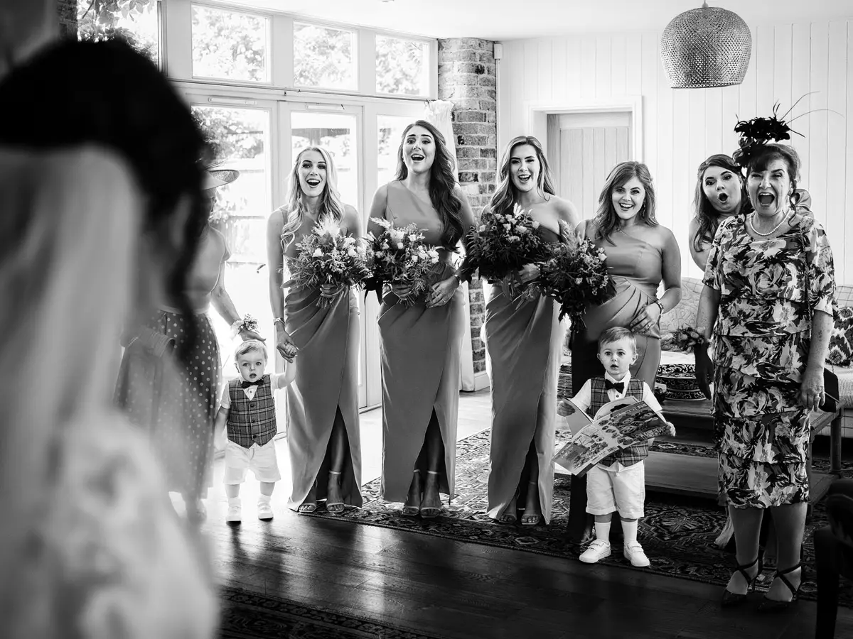 The vicar takes a selfie with the wedding party — Gary Phillip documentary wedding photography