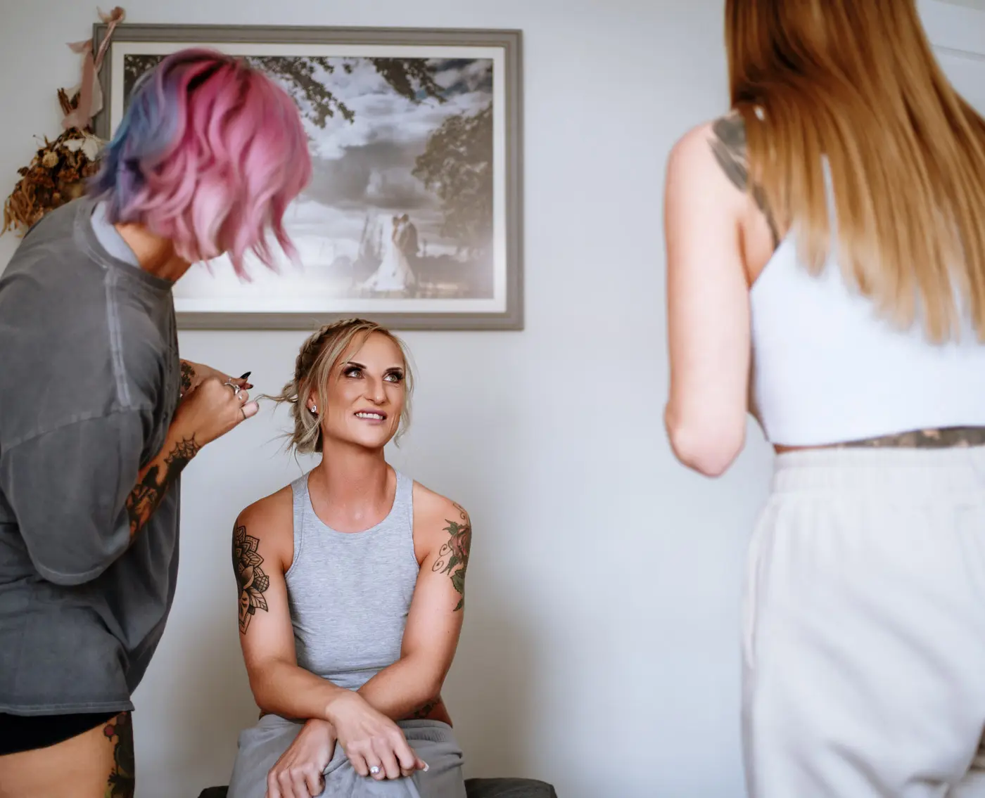 Amy with her makeup and hair artist during wedding morning preparations at Doddington Hall, Lincolnshire