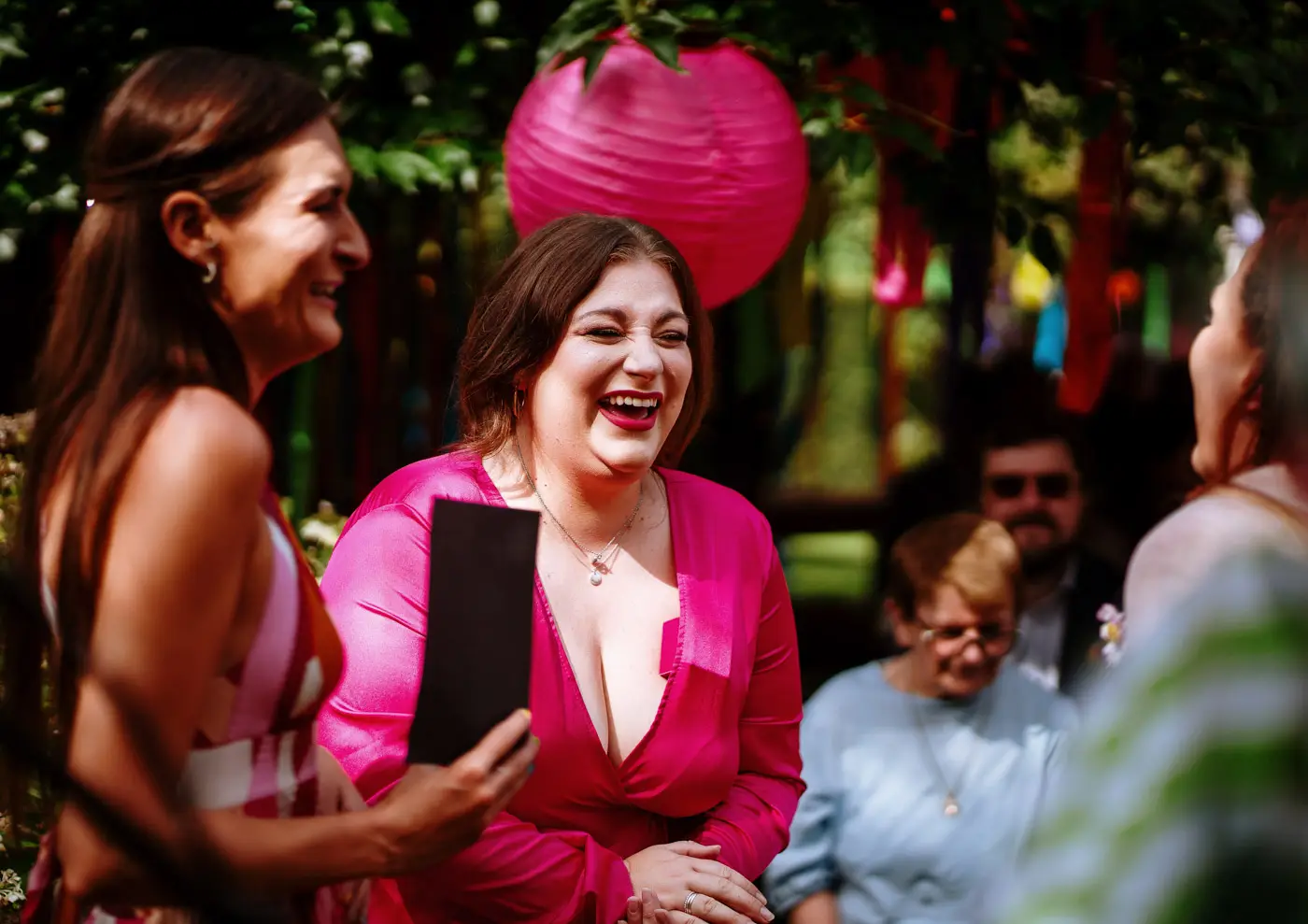 Abby's best women sharing laughs together while waiting for the ceremony to begin at Doddington Hall, Lincolnshire