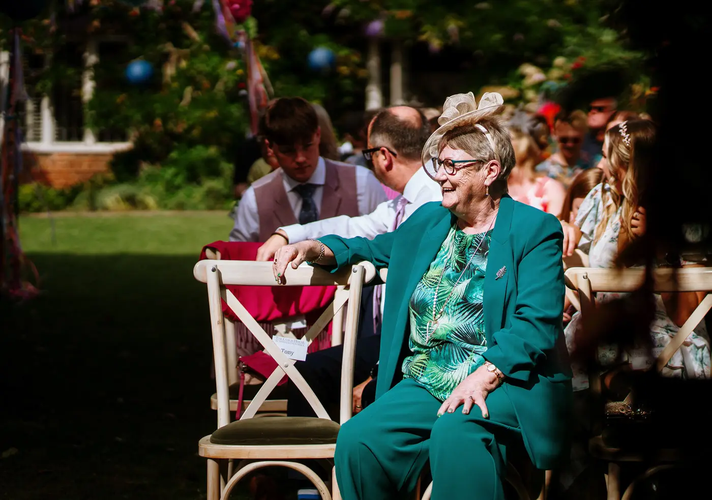 Amy's mother awaiting the ceremony and joining in with the laughter at Doddington Hall, Lincolnshire