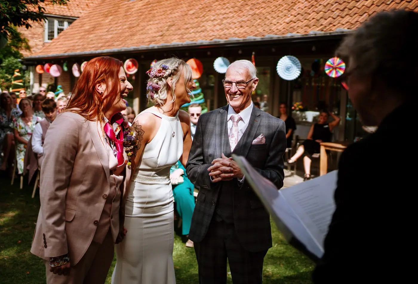 Amy and Abby laughing with Amy's father because he doesn't want to sit down at Doddington Hall, Lincolnshire