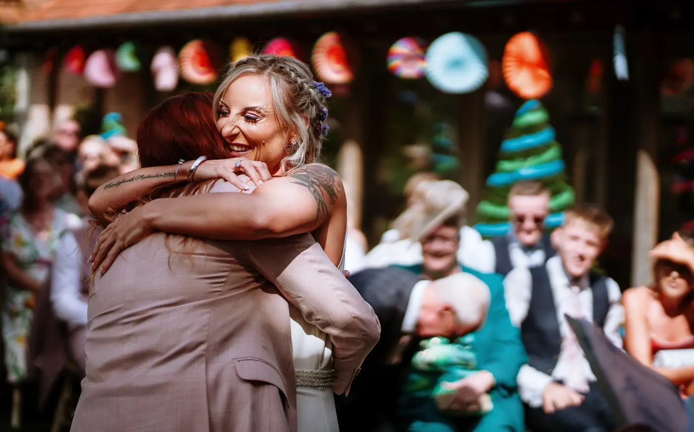 Amy and Abby sharing a big hug before getting married at Doddington Hall, Lincolnshire, a warm tender moment captured by Gary Phillip