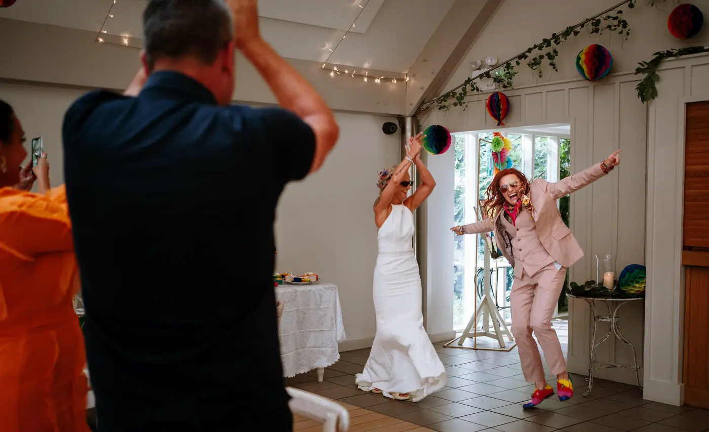 Amy and Abby being announced into the coach house room and dancing in ready for their wedding breakfast at Doddington Hall, Lincolnshire