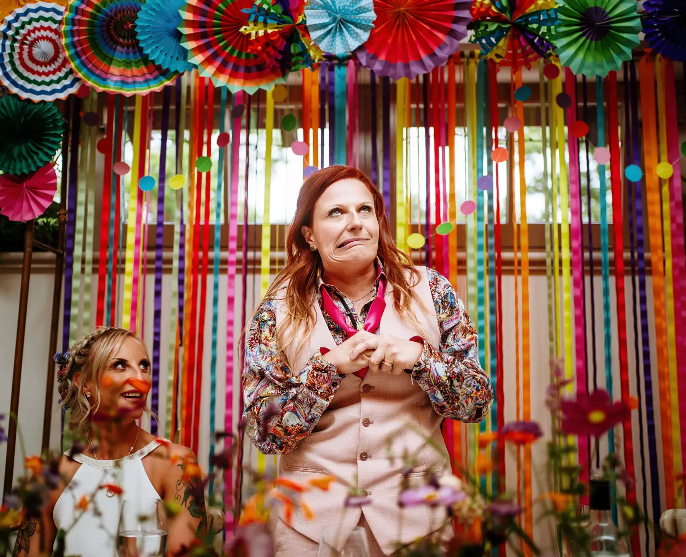 Abby pulling an awkward face during her speech at Doddington Hall, a candid and humorous moment captured by documentary photographer Gary Phillip