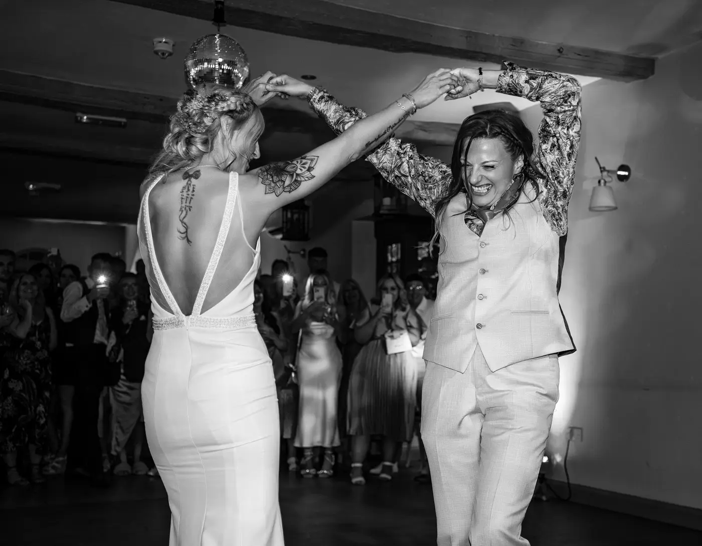 Amy and Abby having a great time dancing while everyone watches on at Doddington Hall, Lincolnshire during their wedding evening