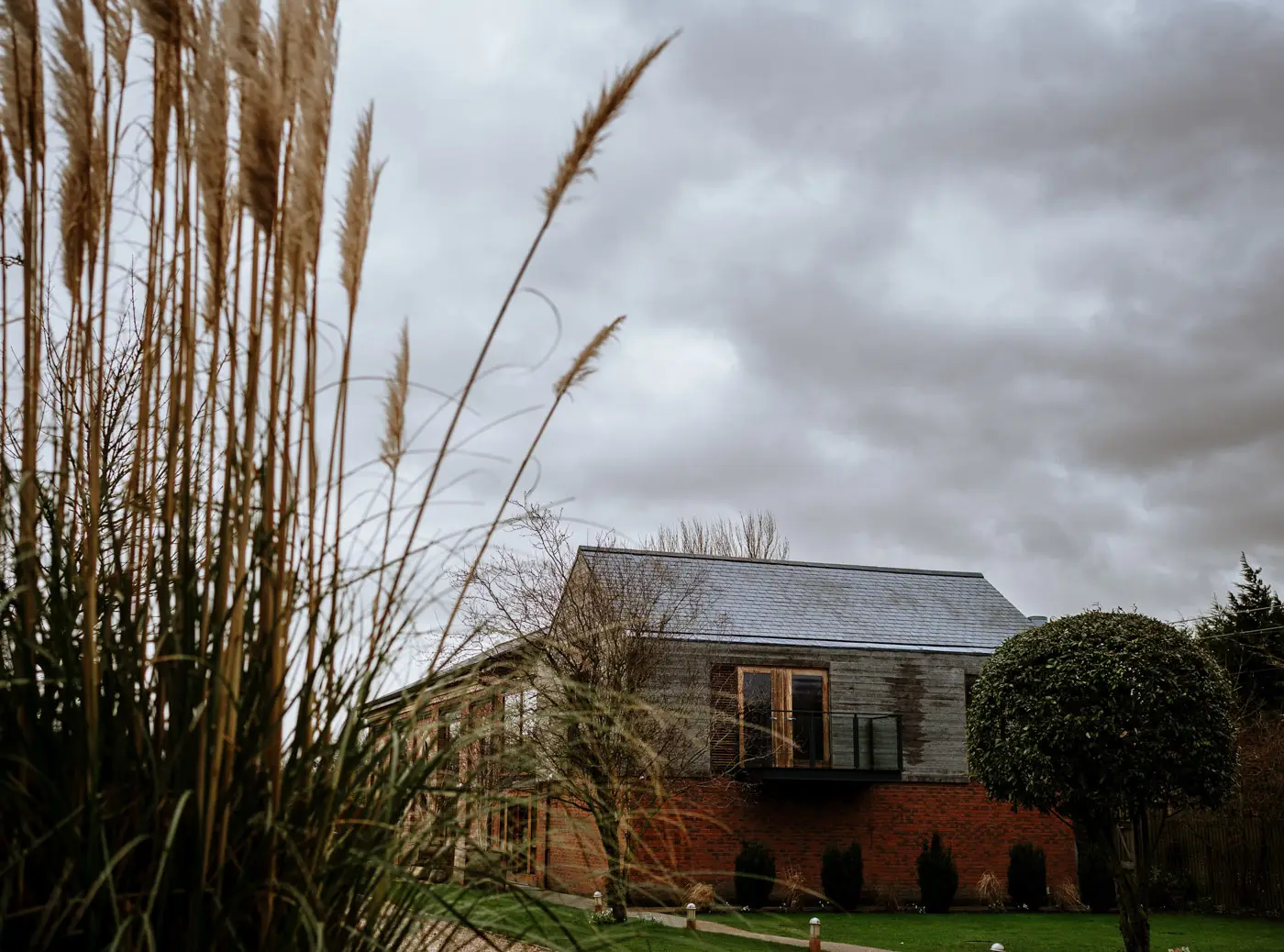 Carriage Hall wedding venue in Nottinghamshire with reeds in the foreground on a winter February wedding day
