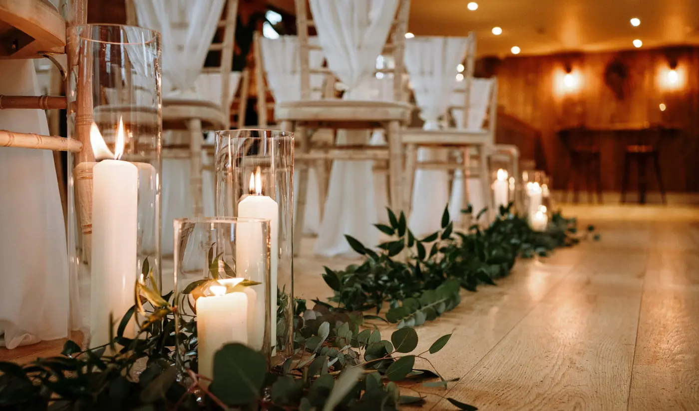 Candles lit at Carriage Hall, Nottinghamshire creating a warm romantic atmosphere for Ellen and Ben's February winter wedding
