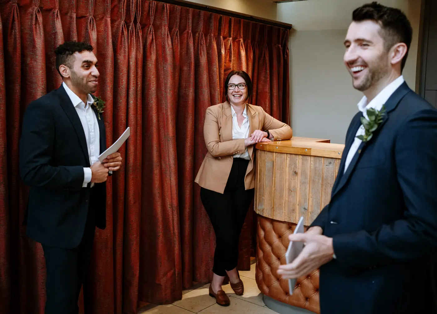 The Carriage Hall wedding planner chatting with the best men ahead of Ellen and Ben's wedding ceremony in Nottinghamshire