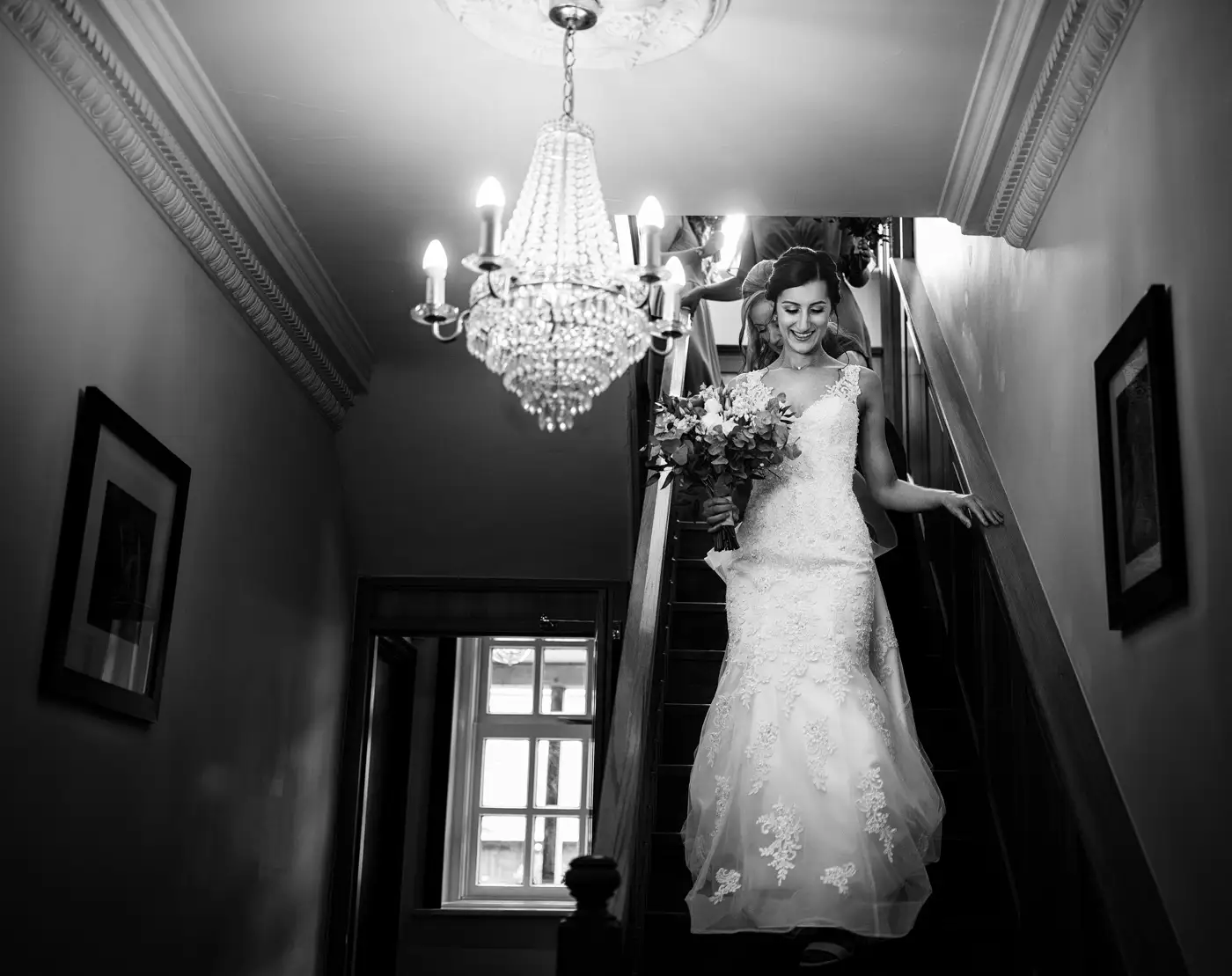 Bride Krissie descending Swancar Farm's staircase ready to meet the registrar, a defining moment from her wedding day captured by Gary Phillip