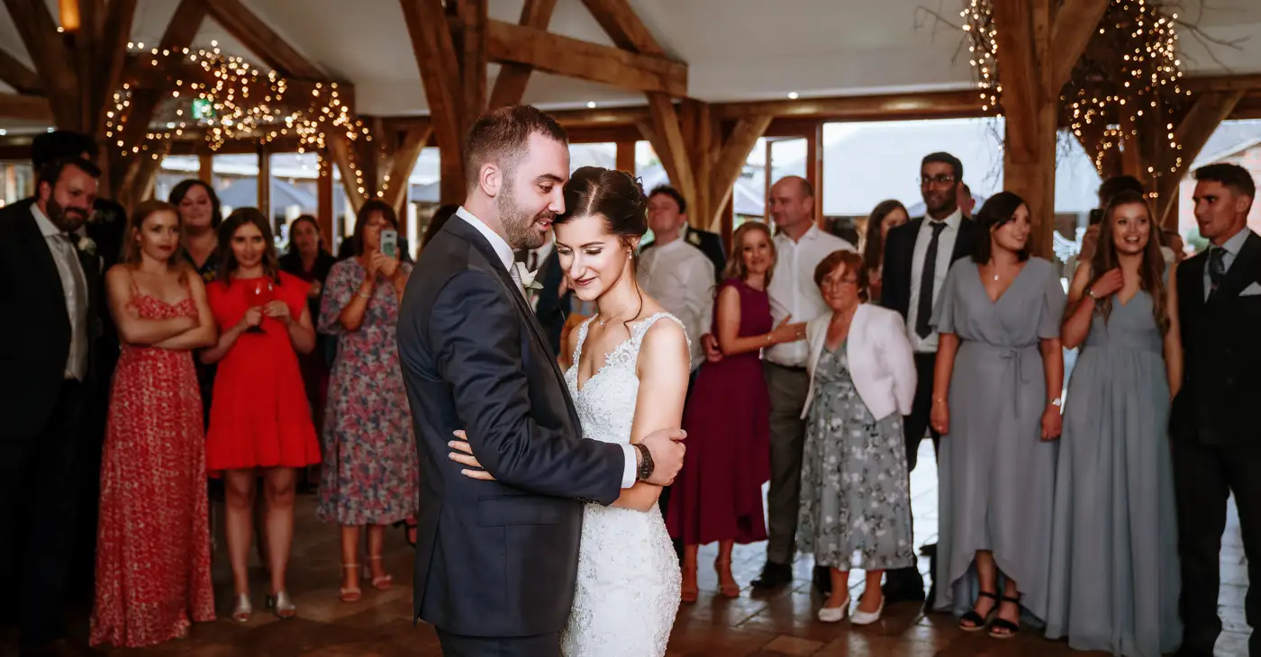 Bride Krissie and groom Tom sharing their first dance at Swancar Farm, Nottinghamshire, a tender wedding evening moment captured by Gary Phillip