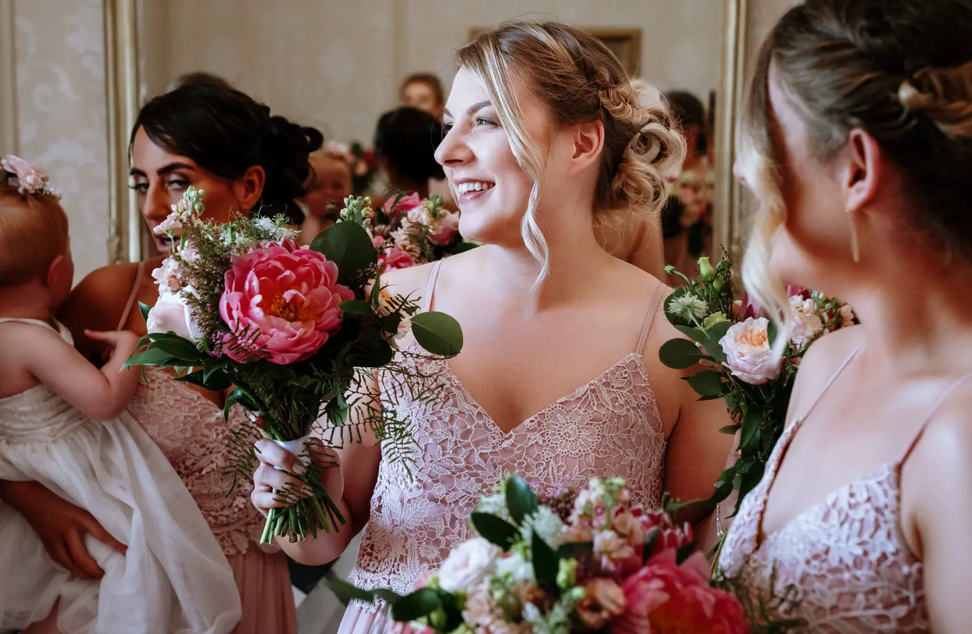 Bridesmaid laughing in beautiful warm light at The Walled Garden at Beeston Fields, Nottingham, candid wedding photography by Gary Phillip