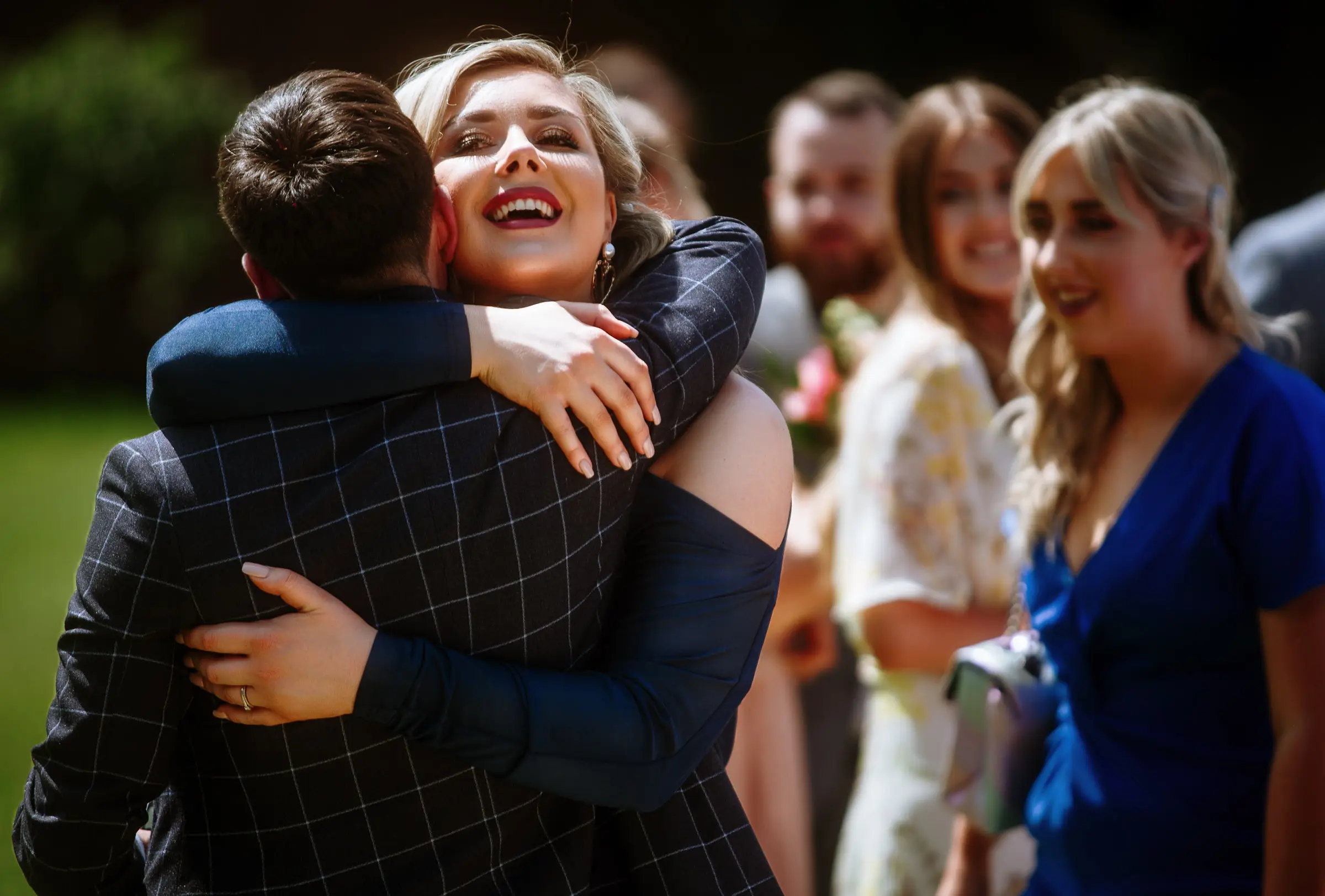 Groom Gavin giving big warm hugs to guests after the wedding ceremony at The Walled Garden at Beeston Fields, Nottingham