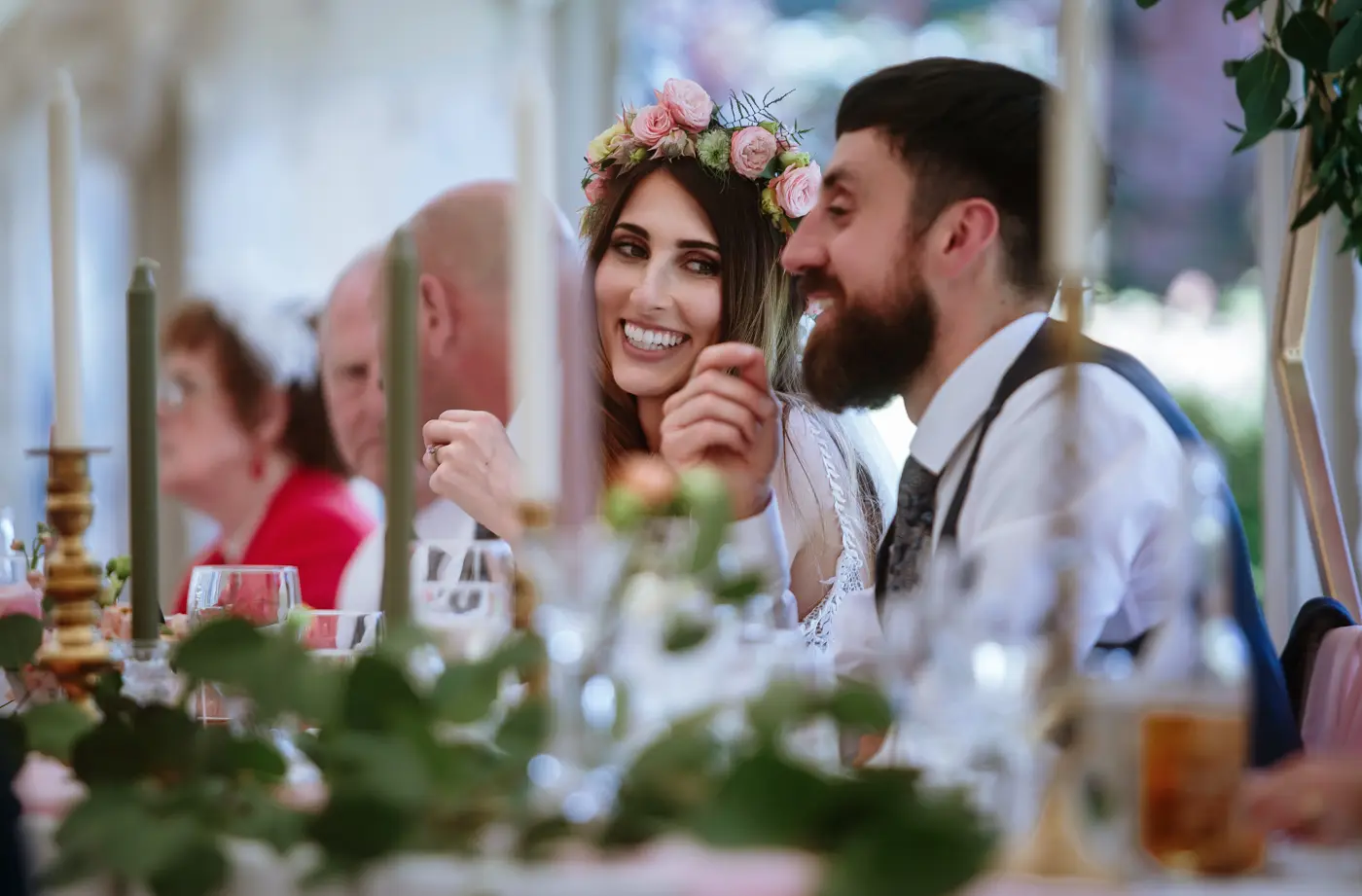 Bride Laura looking longingly at groom Gavin with a big smile during the wedding reception at The Walled Garden at Beeston Fields, Nottingham