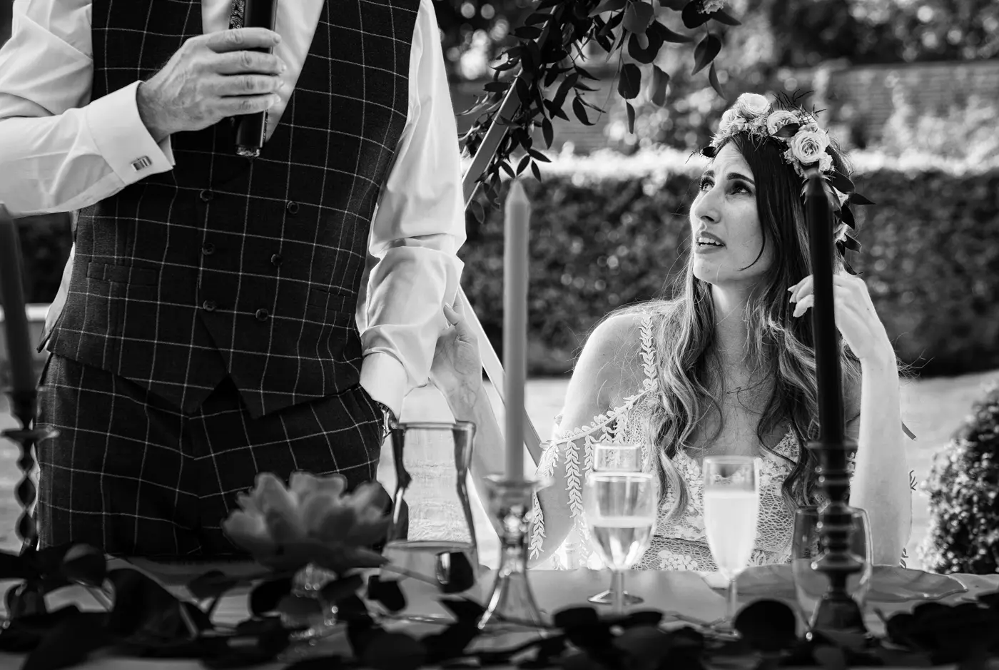 Black and white image of bride Laura holding and comforting her emotional father during his wedding speech at The Walled Garden at Beeston Fields, Nottingham