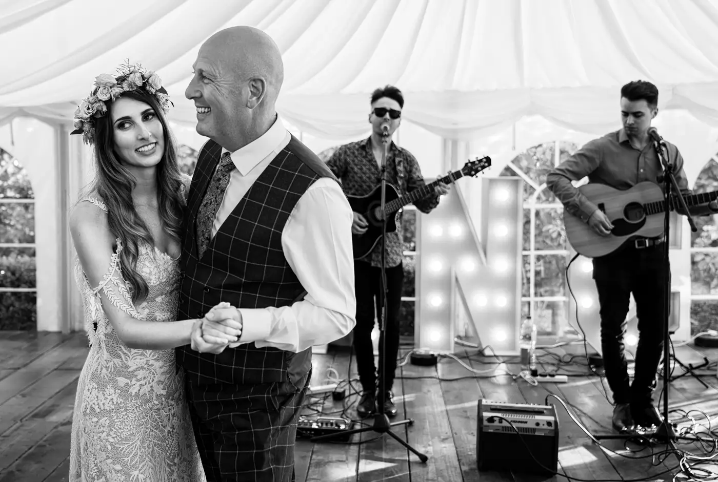 Bride Laura dancing with her father in front of the live band at The Walled Garden at Beeston Fields, Nottingham, father daughter dance photography by Gary Phillip