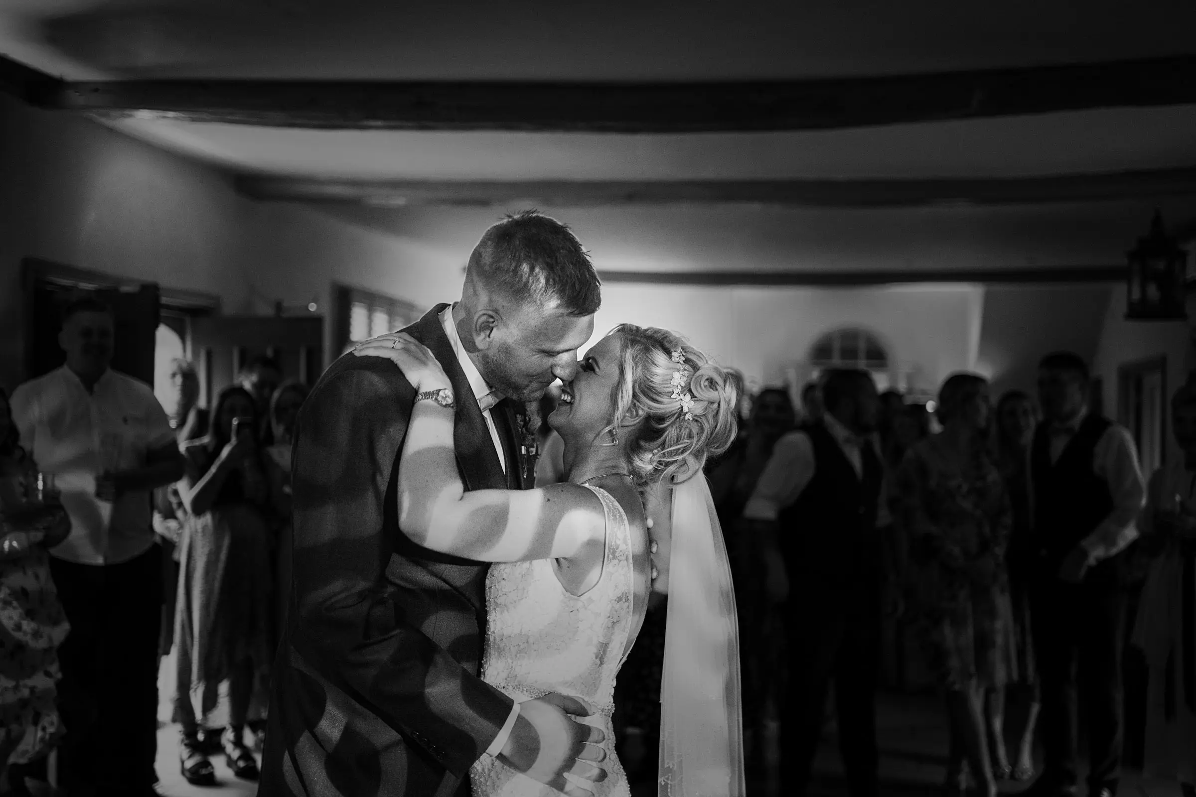 Bride Louise and groom Martin sharing their first dance at Doddington Hall, Lincolnshire on their wedding evening, photographed by Gary Phillip