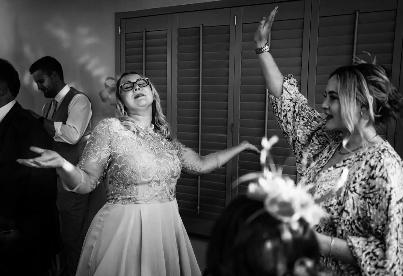 Wedding guests starting to fill the dancefloor at Doddington Hall, Lincolnshire on Louise and Martin's wedding evening