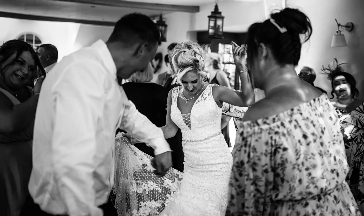 Bride Louise filling the dancefloor with her moves at Doddington Hall, Lincolnshire on her wedding evening, captured by Gary Phillip