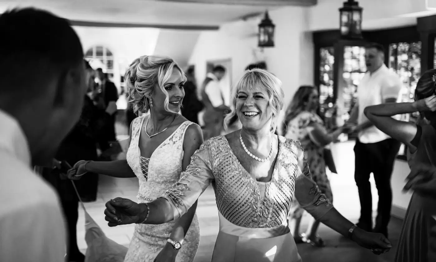 Bride Louise and her mother ripping up the dancefloor together at Doddington Hall, Lincolnshire on her wedding evening