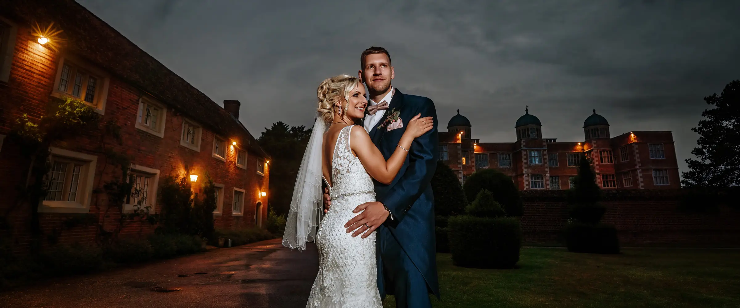 Louise and Martin portrait outside Doddington Hall in the evening light, Lincolnshire
